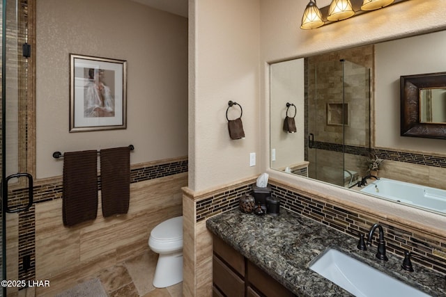 1415 Mcculloch Blvd N Unit 102, Lake Havasu City, AZ 86403 - bathroom featuring vanity, a stall shower, toilet, and tile walls