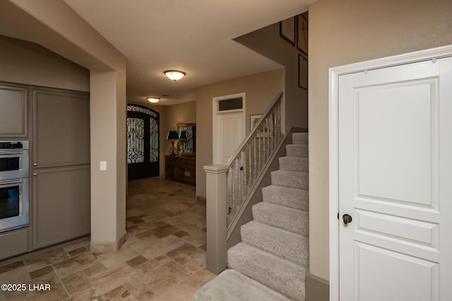 1415 Mcculloch Blvd N Unit 102, Lake Havasu City, AZ 86403 - foyer entrance with stone finish floor, baseboards, and stairs