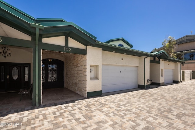 1415 Mcculloch Blvd N Unit 102, Lake Havasu City, AZ 86403 - exterior space featuring a garage and stucco siding