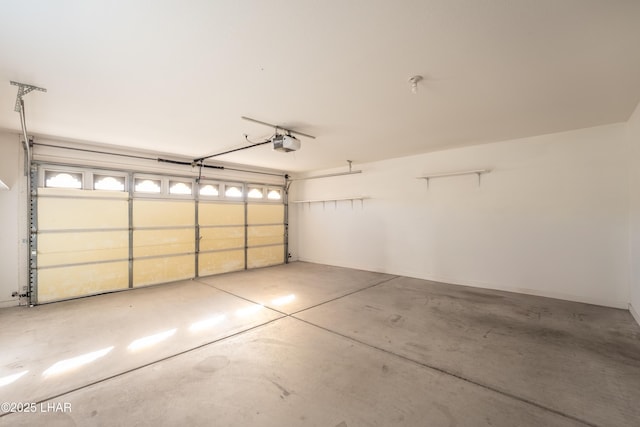 garage featuring a garage door opener
