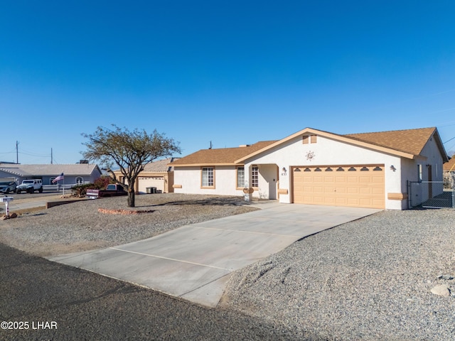 ranch-style house featuring a garage