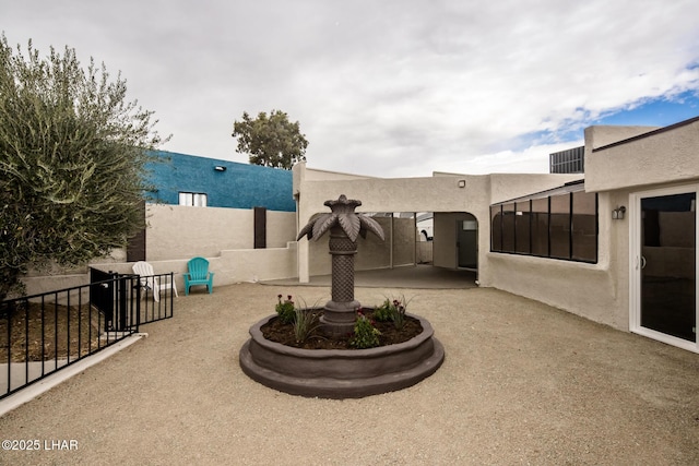 view of patio / terrace featuring fence