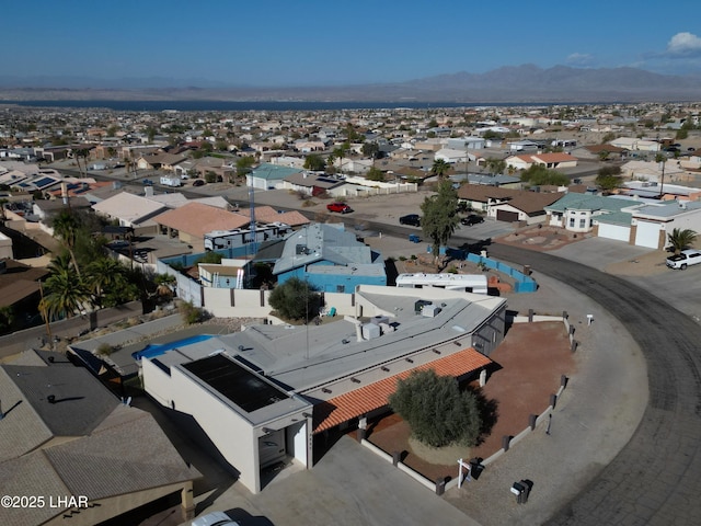 birds eye view of property with a mountain view and a residential view