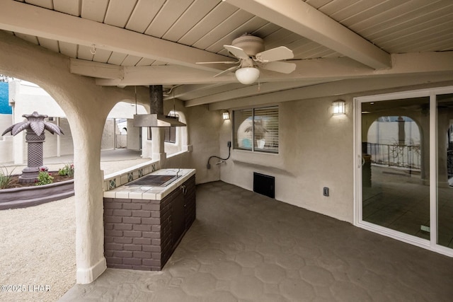 view of patio / terrace with an outdoor kitchen and ceiling fan