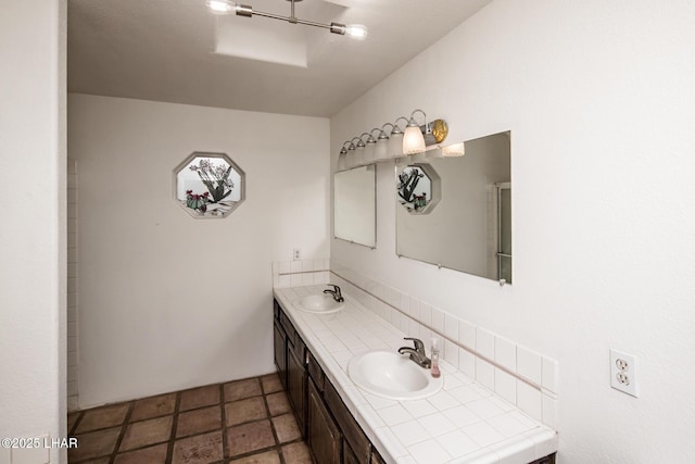 full bathroom with a sink and double vanity