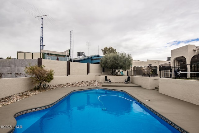 view of swimming pool featuring a fenced backyard and a fenced in pool