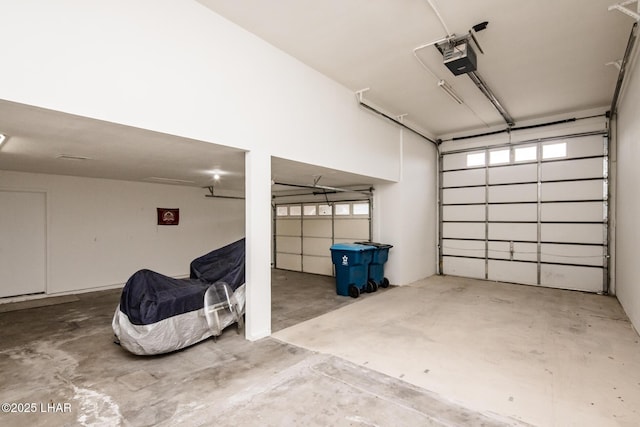 garage featuring a garage door opener