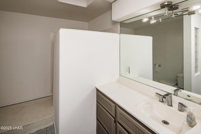 bathroom with toilet and vanity