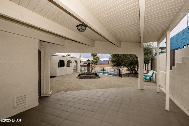 view of patio / terrace featuring visible vents and fence