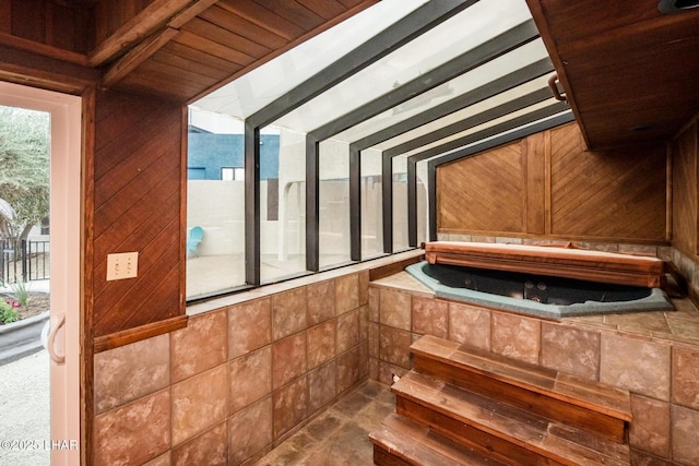 interior space with a wealth of natural light and vaulted ceiling