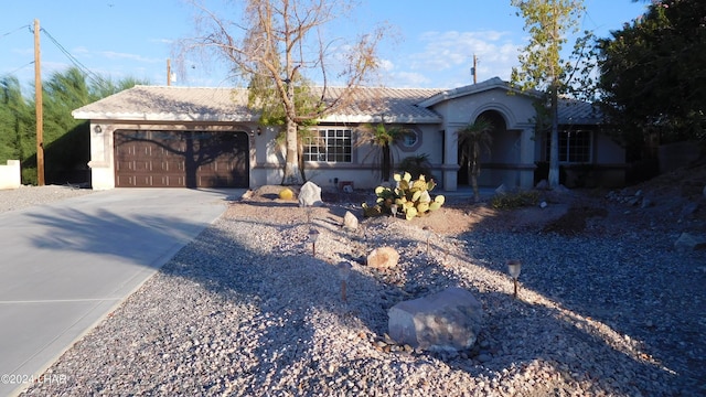 ranch-style house featuring a garage