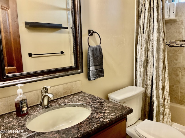 full bathroom featuring toilet, vanity, and shower / bath combo