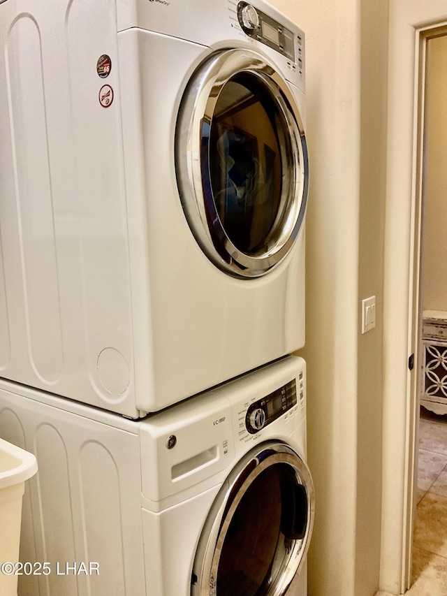 laundry room with laundry area and stacked washer and dryer