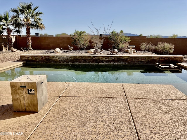 view of pool featuring a fenced in pool and a fenced backyard