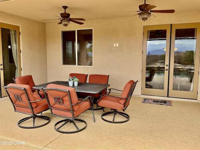 view of patio featuring outdoor dining area and ceiling fan