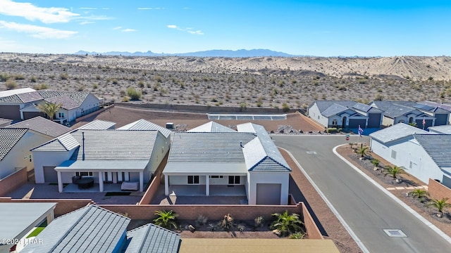 birds eye view of property with a mountain view