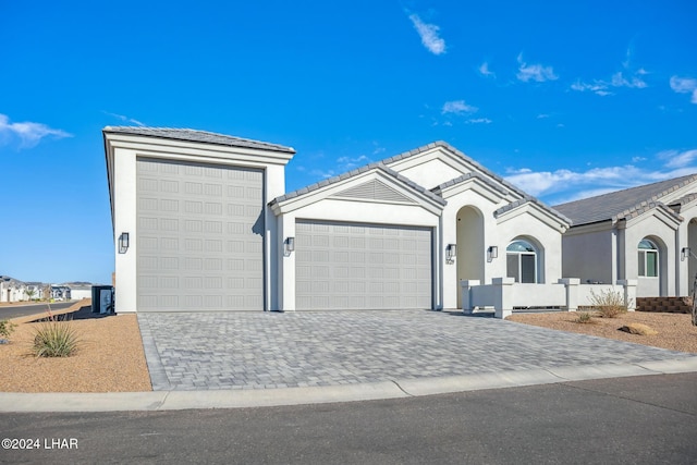 ranch-style house featuring a garage