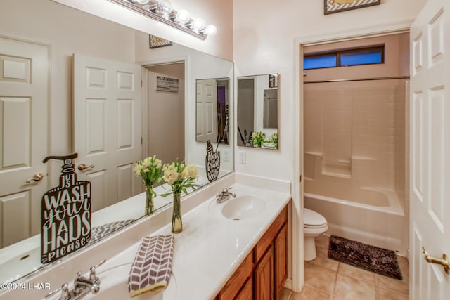 full bathroom with vanity, tub / shower combination, tile patterned floors, and toilet