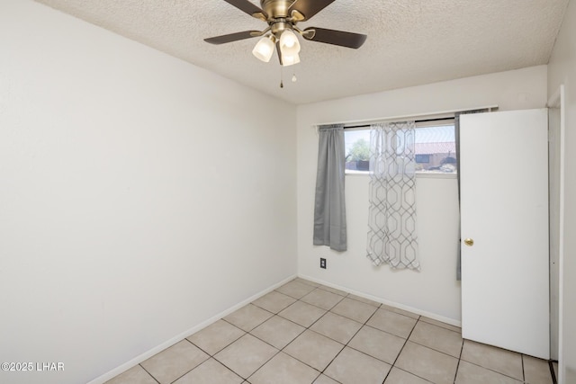 1116 W 4th St, Parker, AZ 85344 - unfurnished room featuring a textured ceiling, a ceiling fan, and light tile patterned floors