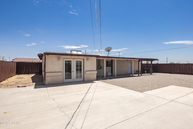 1116 W 4th St, Parker, AZ 85344 - back of house featuring a patio area, a fenced backyard, stucco siding, and french doors