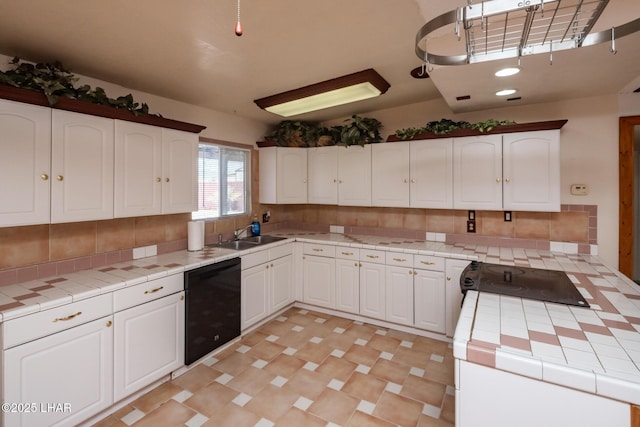 1116 W 4th St, Parker, AZ 85344 - kitchen featuring black dishwasher, tile counters, white cabinets, backsplash, and range