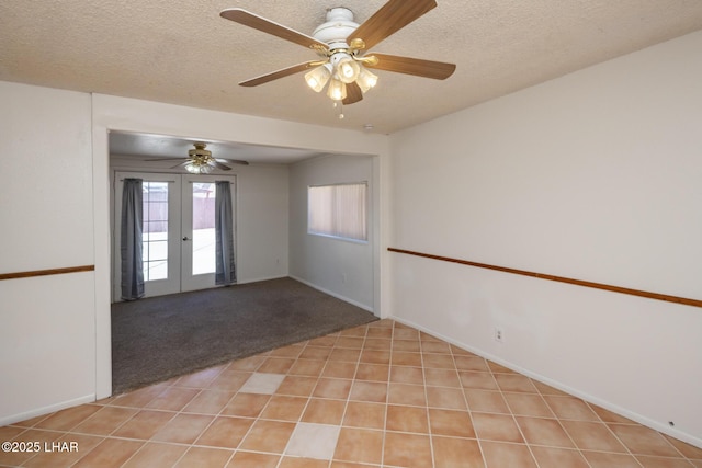 1116 W 4th St, Parker, AZ 85344 - spare room with french doors, a textured ceiling, ceiling fan, and light colored carpet