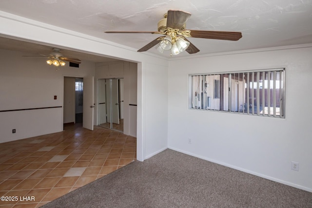 1116 W 4th St, Parker, AZ 85344 - empty room featuring ceiling fan, plenty of natural light, and carpet flooring