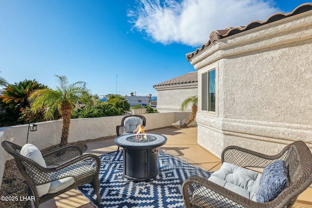 view of patio / terrace featuring a fire pit