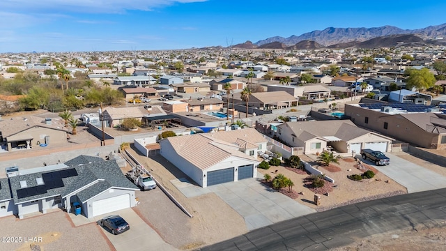 drone / aerial view featuring a mountain view and a residential view