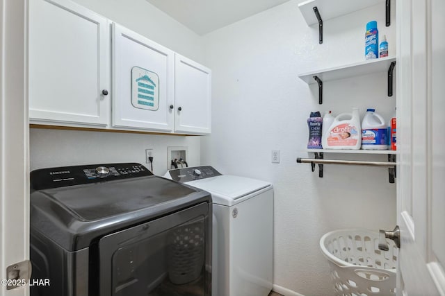 laundry area with cabinet space and washing machine and dryer