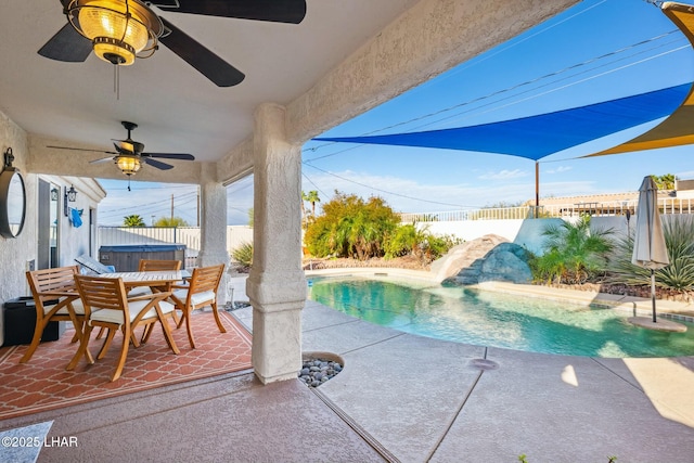 view of pool featuring a fenced backyard, a hot tub, a water slide, and a patio