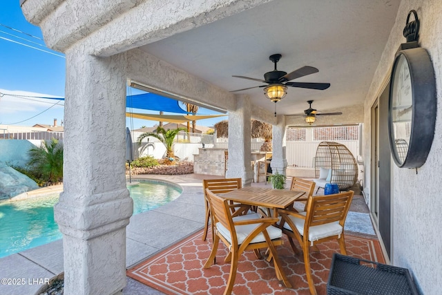 view of patio / terrace with outdoor dining area, a fenced in pool, a fenced backyard, and a ceiling fan