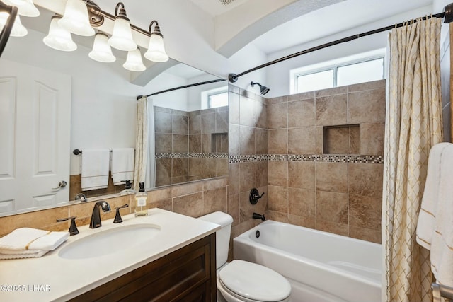 bathroom featuring shower / tub combo with curtain, vanity, and toilet