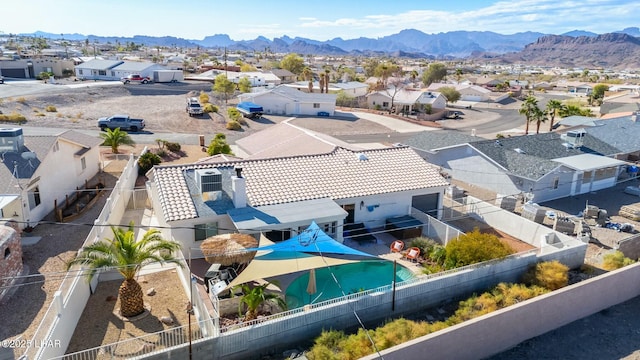 birds eye view of property featuring a mountain view and a residential view