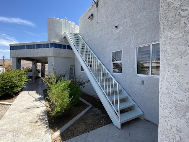 211 Columbine Dr, Lake Havasu City, AZ 86403 - view of home's exterior featuring stucco siding and stairway