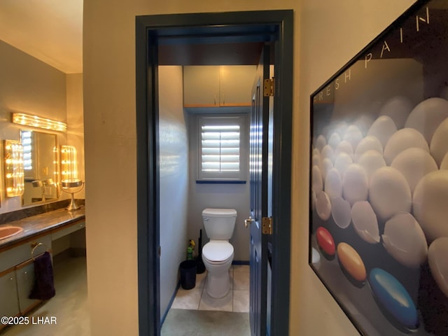 211 Columbine Dr, Lake Havasu City, AZ 86403 - bathroom featuring toilet, tile patterned floors, and vanity