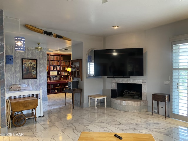 211 Columbine Dr, Lake Havasu City, AZ 86403 - living area with ceiling fan, a wealth of natural light, marble finish floor, and a fireplace