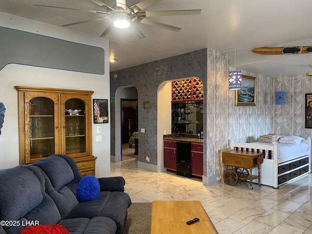 211 Columbine Dr, Lake Havasu City, AZ 86403 - living area featuring arched walkways, ceiling fan, wallpapered walls, and marble finish floor
