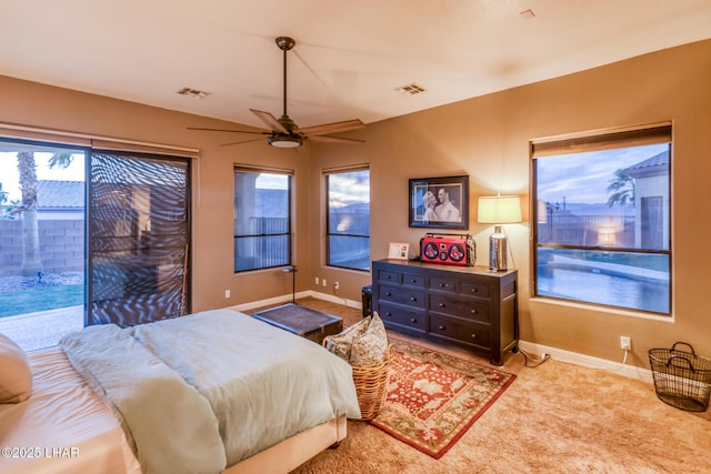 bedroom featuring baseboards, multiple windows, and visible vents