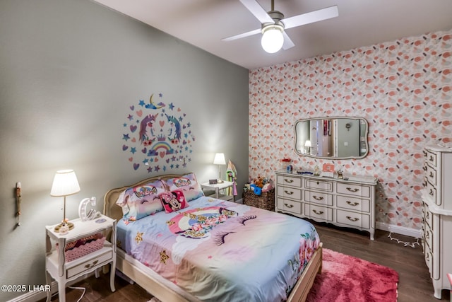 bedroom featuring a ceiling fan, wallpapered walls, baseboards, and dark wood-type flooring