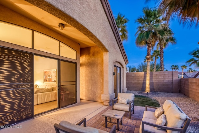 view of patio with outdoor lounge area and a fenced backyard