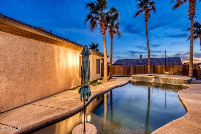 pool at dusk with a patio area, a fenced backyard, and a fenced in pool