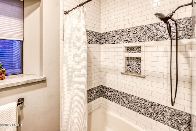 full bathroom featuring shower / bath combo with shower curtain