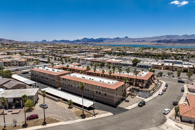 birds eye view of property with a mountain view