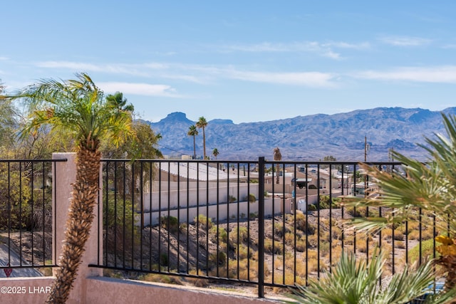 view of gate with a mountain view