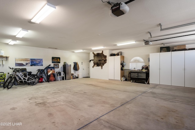 garage featuring a garage door opener