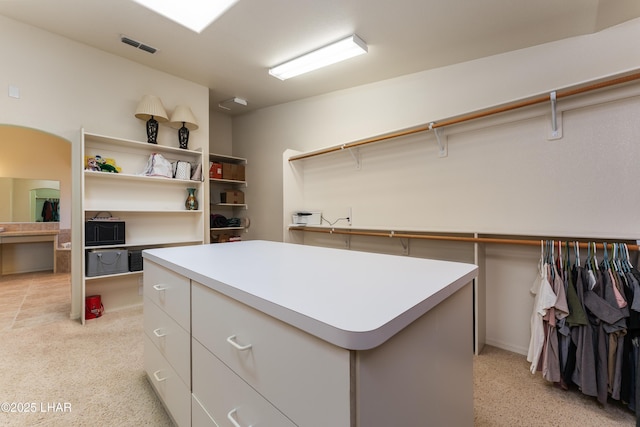 walk in closet with visible vents