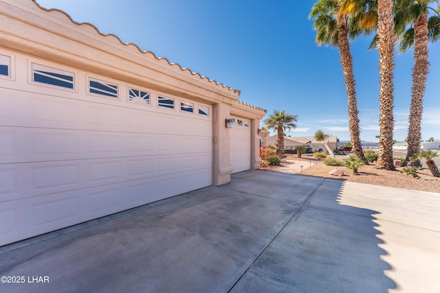 garage featuring driveway