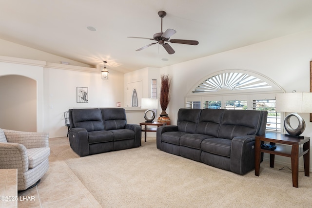 carpeted living room featuring lofted ceiling, tile patterned flooring, and a ceiling fan