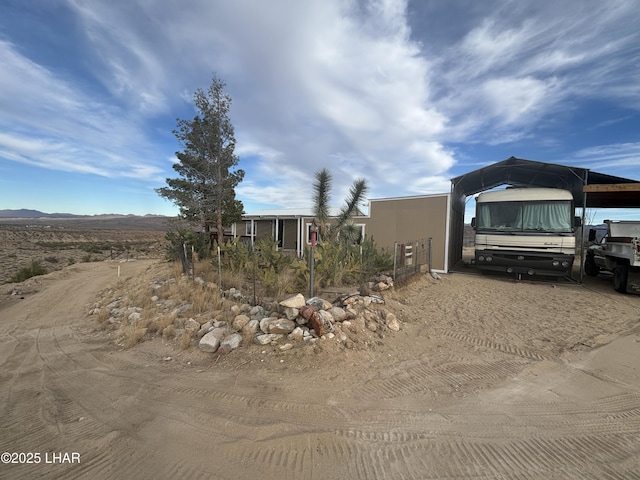 view of front of property featuring a carport